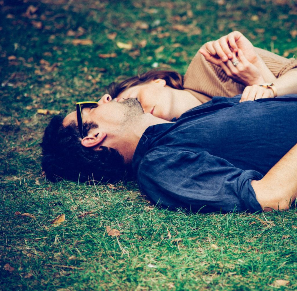 couple lying in the grass