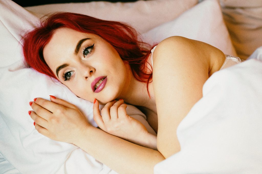 red head awake in bed