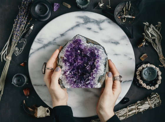 woman holding large amethyst