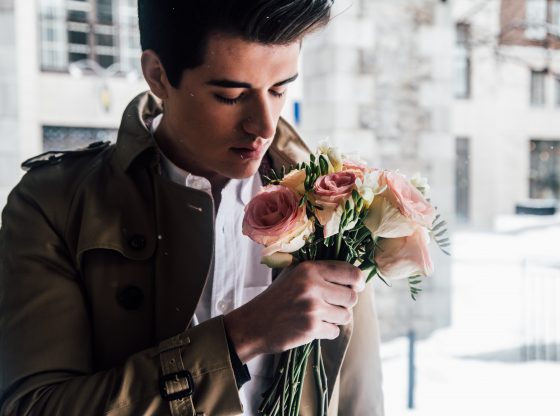 man with bouquet of flowers