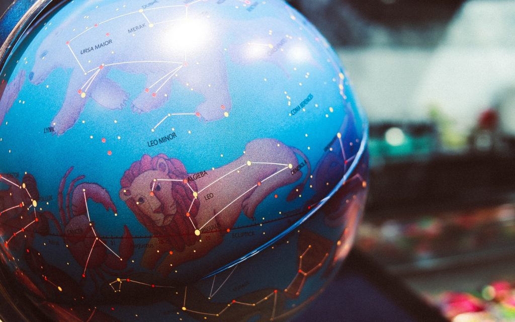 globe with leo astrological sign
