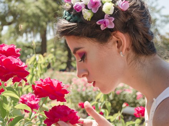 Women smelling flowers