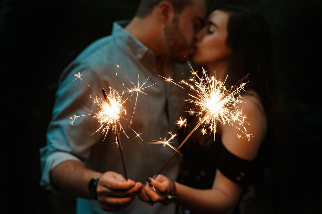 couple holding Gold Sparklers.