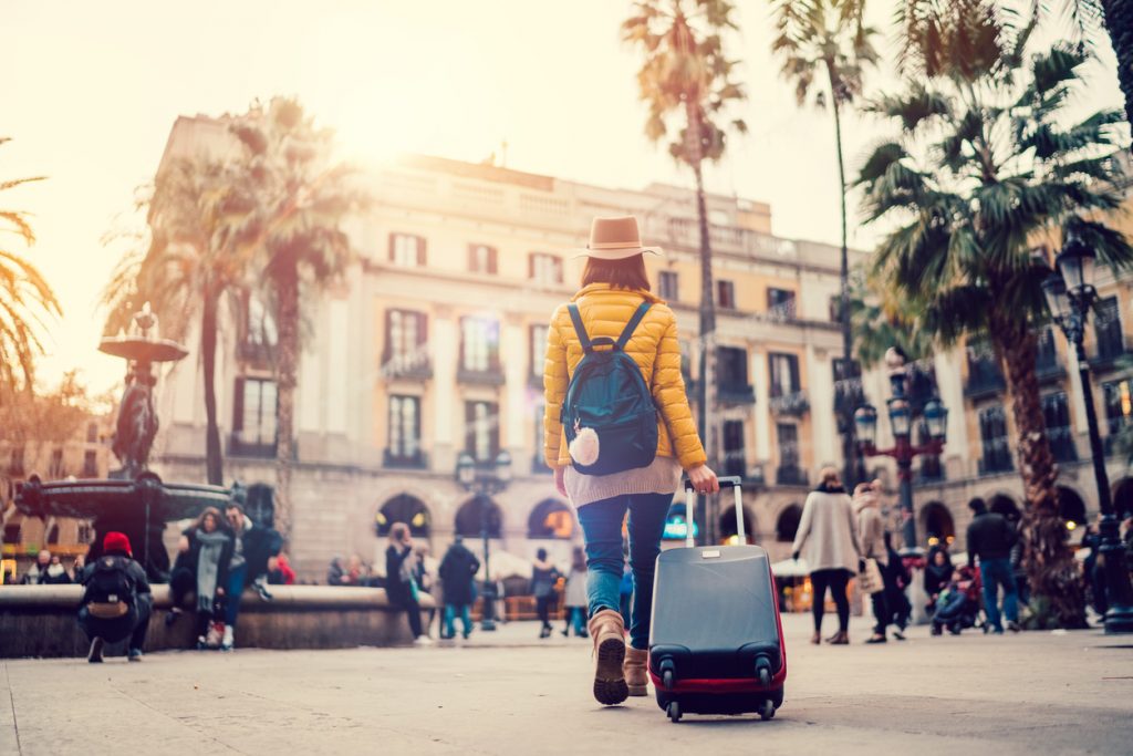woman with suitcase in Spain