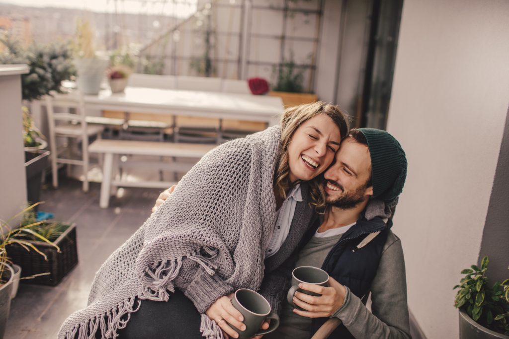 cozy couple sitting with coffee