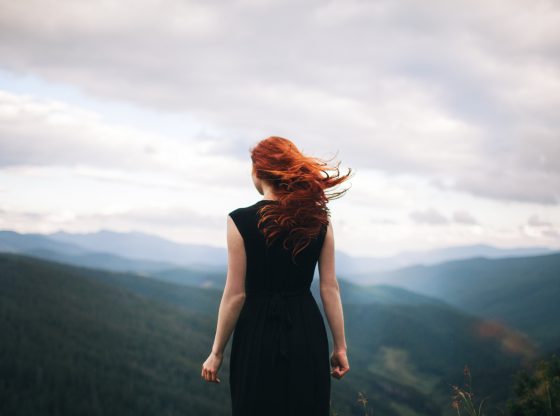 red haired woman in the wind