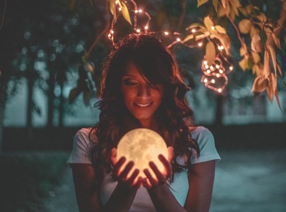 girl holding moon lamp