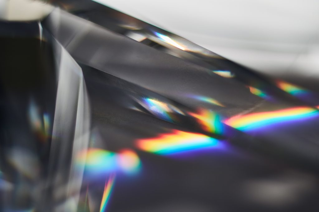 crystal dispersing light into rainbow