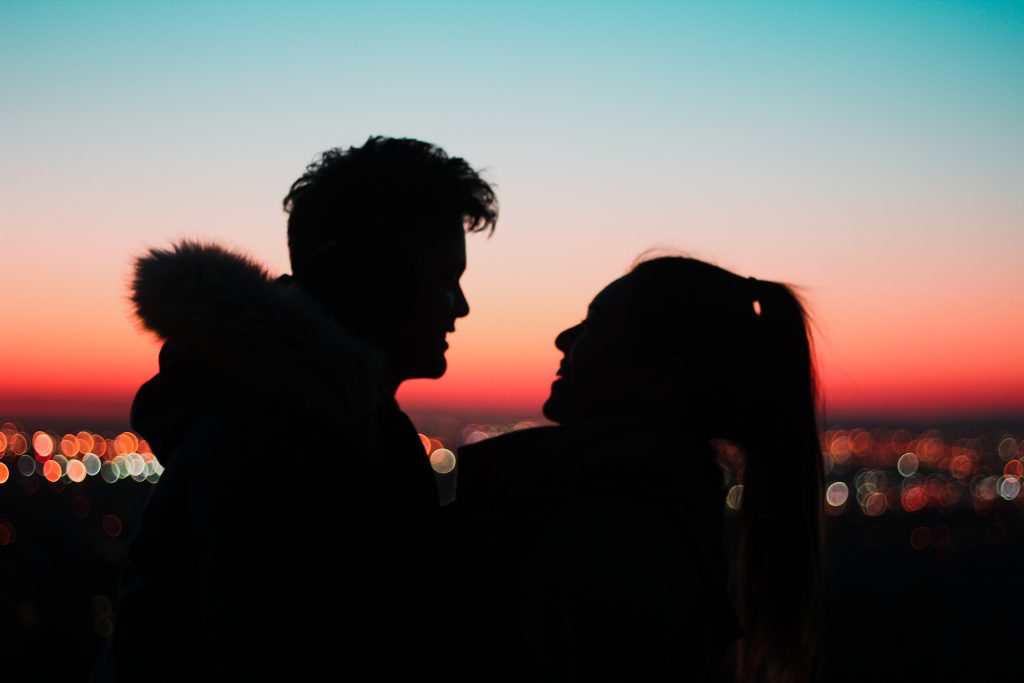 silhouette of couple at dusk