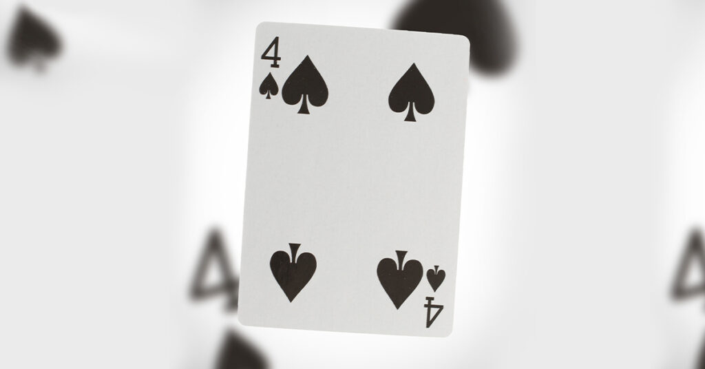 black and white photo of a 4 of spades card to convey the meaning of this card in the deck