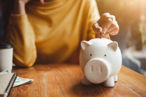 woman-hand-putting-money-coin