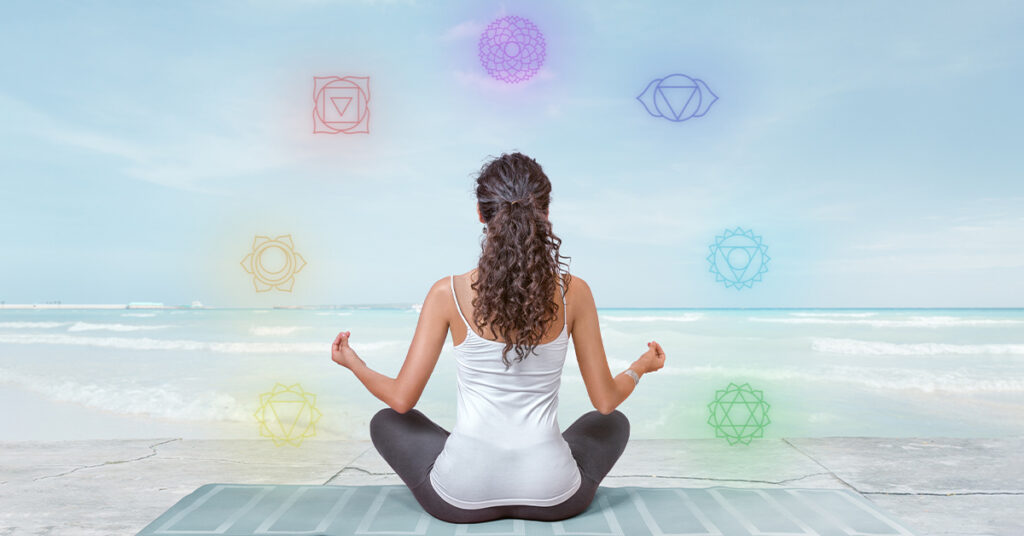 a yogi meditating and balancing all seven chakras
