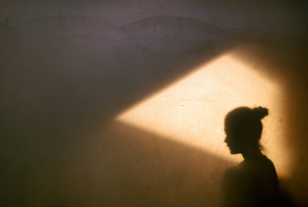 A woman’s shadow against a wall